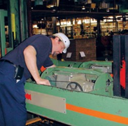 Mechanic inspecting the machine.