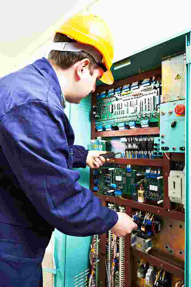 Service technician examining the station.