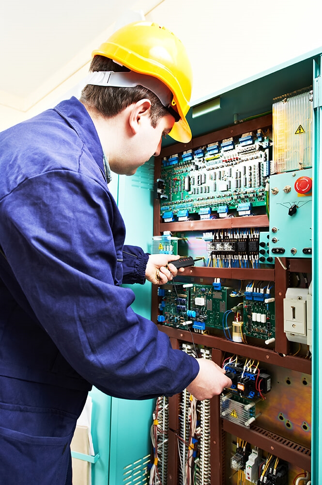 Service technician examining the station.